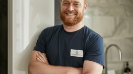 Gas Safe registered engineer carrying out a professional boiler installation in a residential kitchen, ensuring safe setup and efficient heating performance.